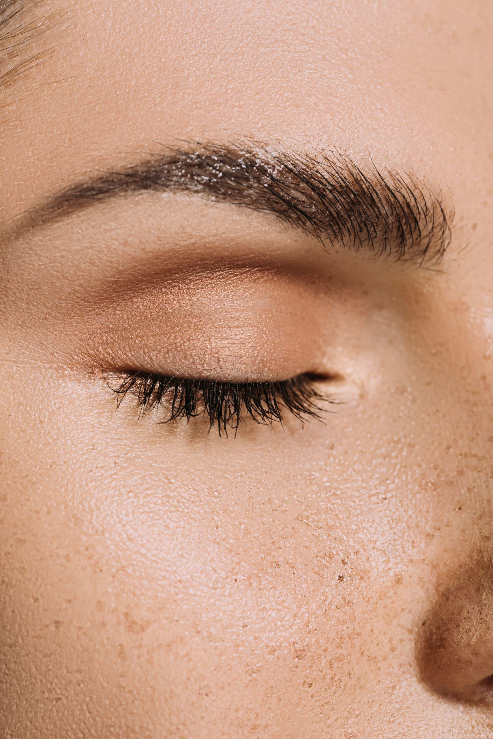 close up view of female face with freckles close up view of female face with freckles